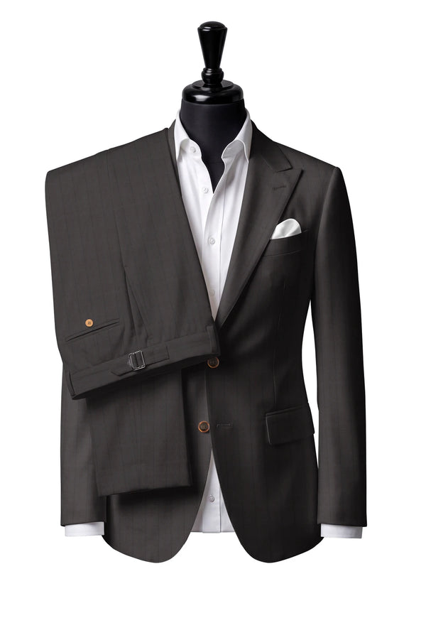 Two-button peak-lapel jacket with straight flap pockets. Trousers with side adjusters.
