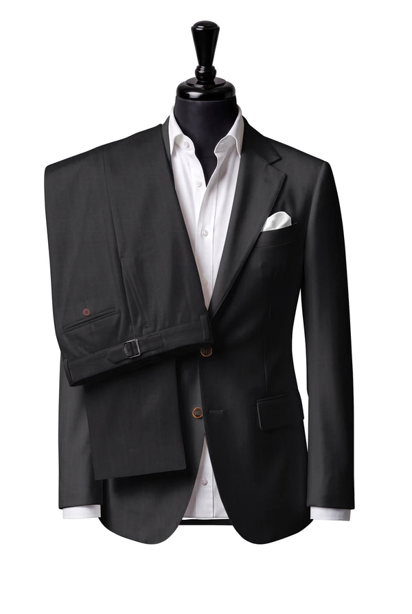 Two-button notch-lapel jacket with straight flap pockets. Trousers with side adjusters.