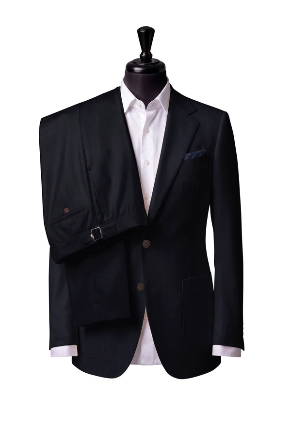 Two-button notch-lapel jacket with patch pockets. Trousers with side adjusters.