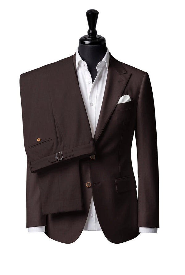 Two-button peak-lapel jacket with straight flap pockets. Trousers with side adjusters.