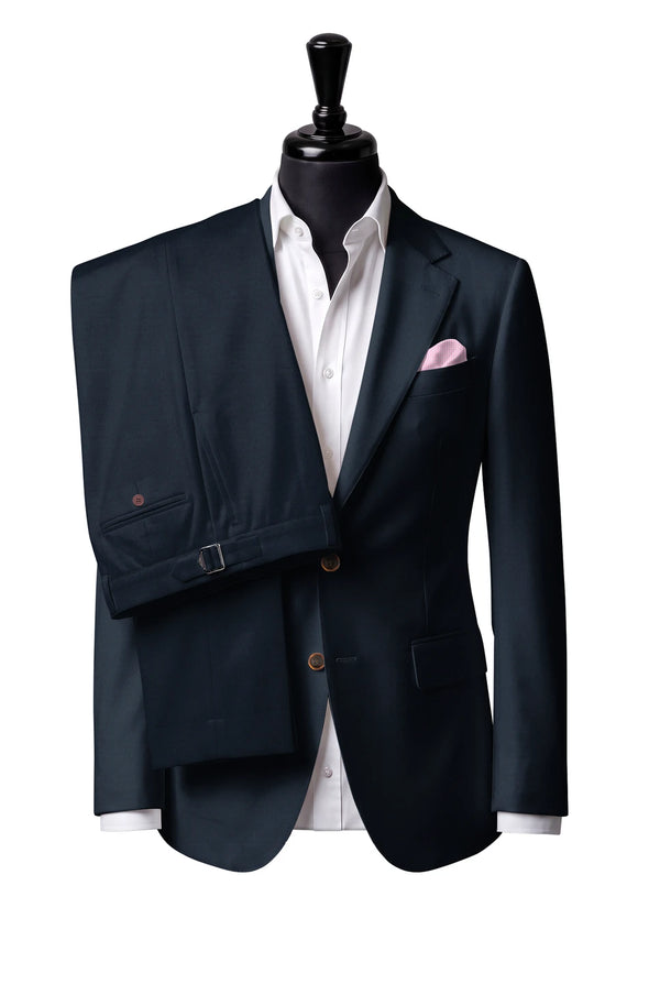 Two-button notch-lapel jacket with straight flap pockets. Trousers with side adjusters.