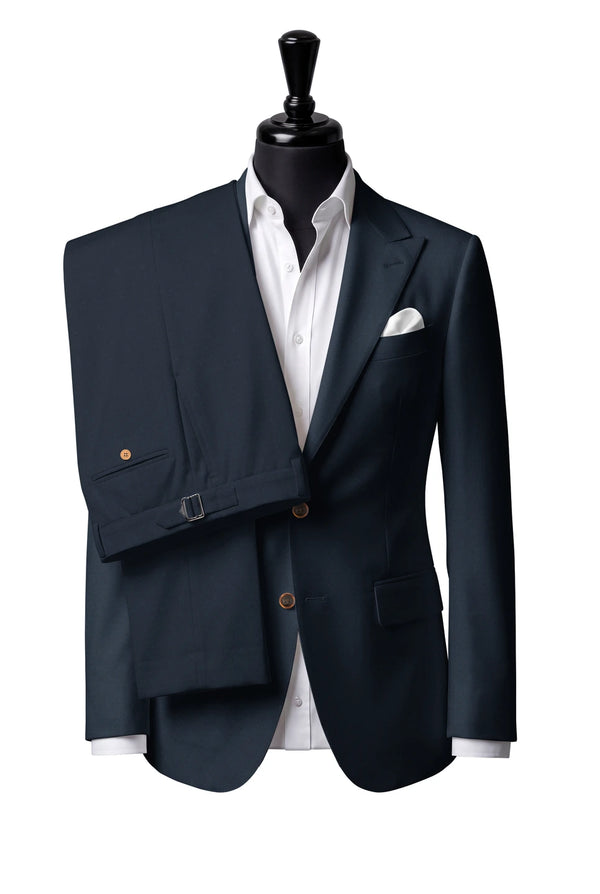 Two-button peak-lapel jacket with straight flap pockets. Trousers with side adjusters.