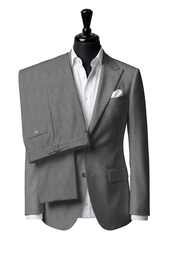 Two-button peak-lapel jacket with straight flap pockets. Trousers with side adjusters.