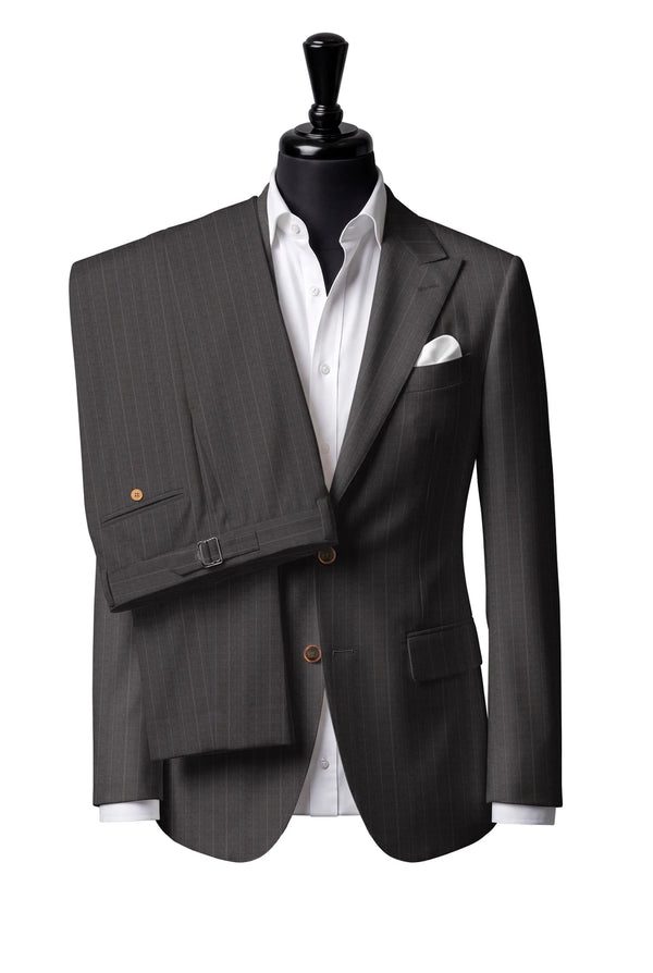 Two-button peak-lapel jacket with straight flap pockets. Trousers with side adjusters.