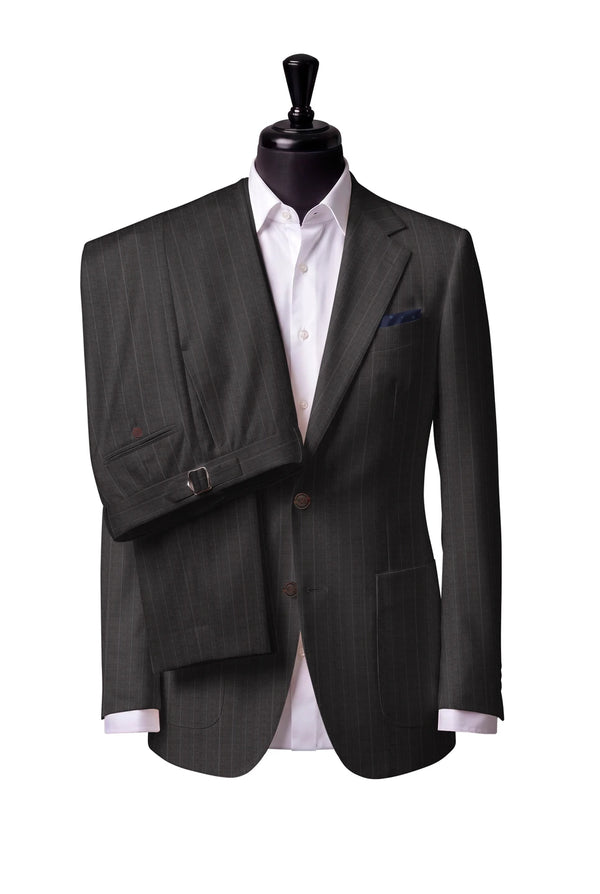 Two-button notch-lapel jacket with patch pockets. Trousers with side adjusters.