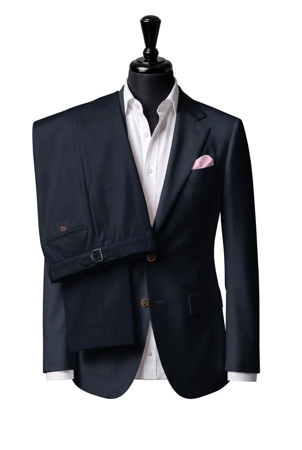 Two-button notch-lapel jacket with straight flap pockets. Trousers with side adjusters.