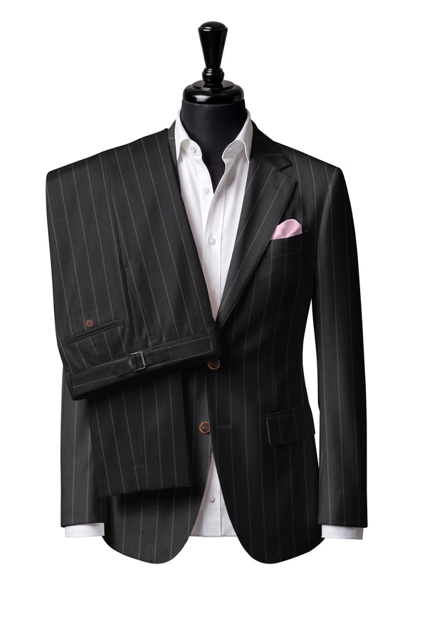 Two-button notch-lapel jacket with straight flap pockets. Trousers with side adjusters.